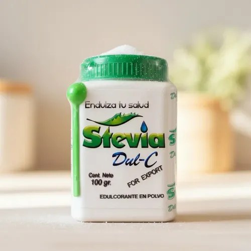 Pote de adoçante Dul C Stevia em pó de 100g, com tampa verde e rótulo branco e verde, sobre superfície clara.
