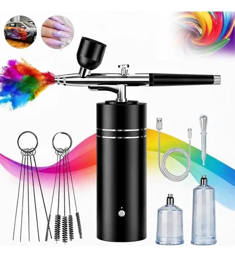 Kit completo de aerógrafo recarregável com mini compressor portátil sem fio, acessórios e recipientes de tinta colorida sobre superfície branca