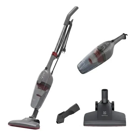 Aspirador de pó vertical Electrolux STK15 na cor cinza-escuro, exibindo o corpo principal, o bocal de piso, o bocal de canto e o aspirador de mão removido